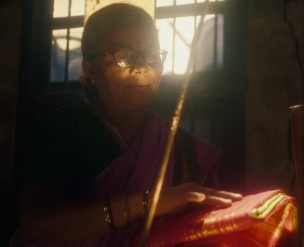 Weaver working on the loom