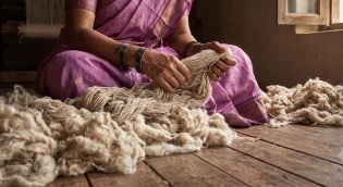 Weaver preparing cotton thread bundles